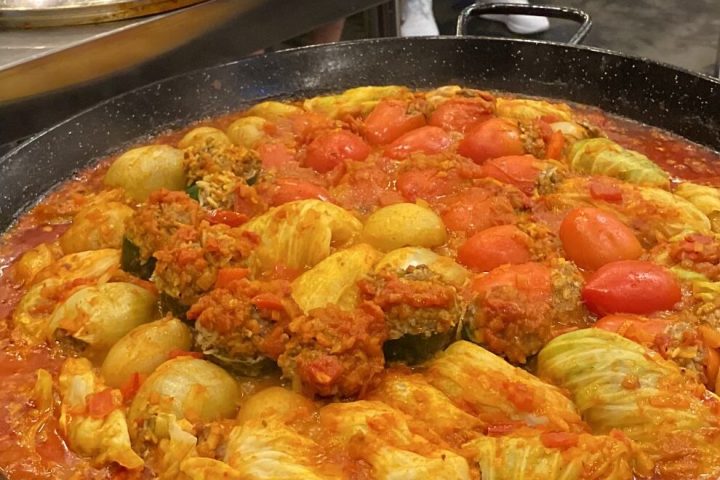 a person cooking food in a pan