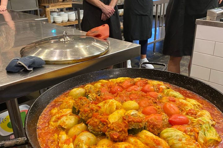 a person cooking pizza