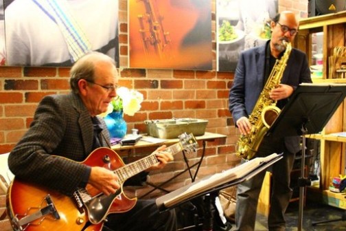 a person holding a guitar