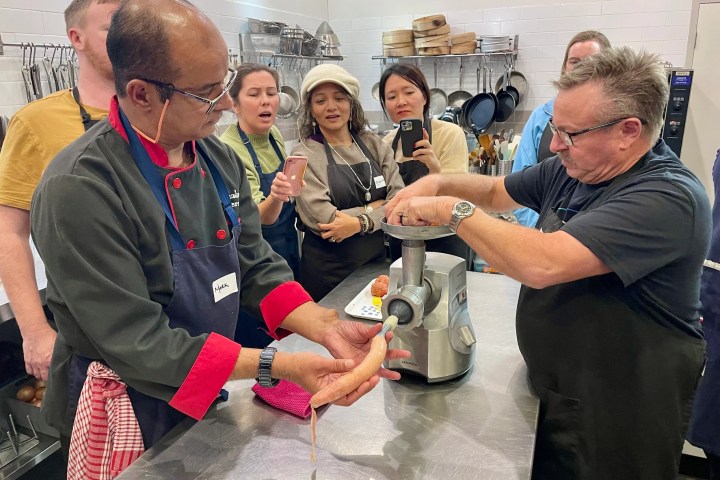 a group of people looking at a phone