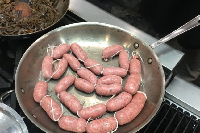 food on a metal pan on a stove