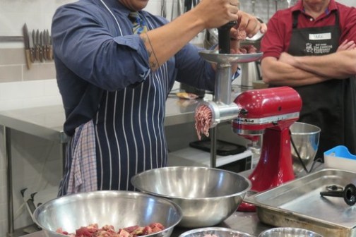 a person cooking in a kitchen preparing food