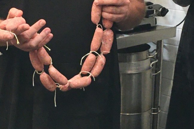 a man standing in front of a mirror posing for the camera