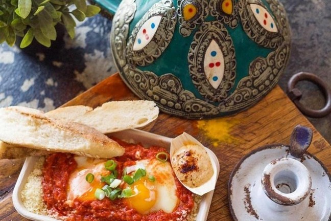 a sandwich sitting on top of a wooden table