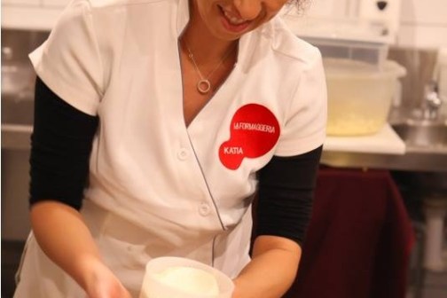 a woman preparing food in a kitchen