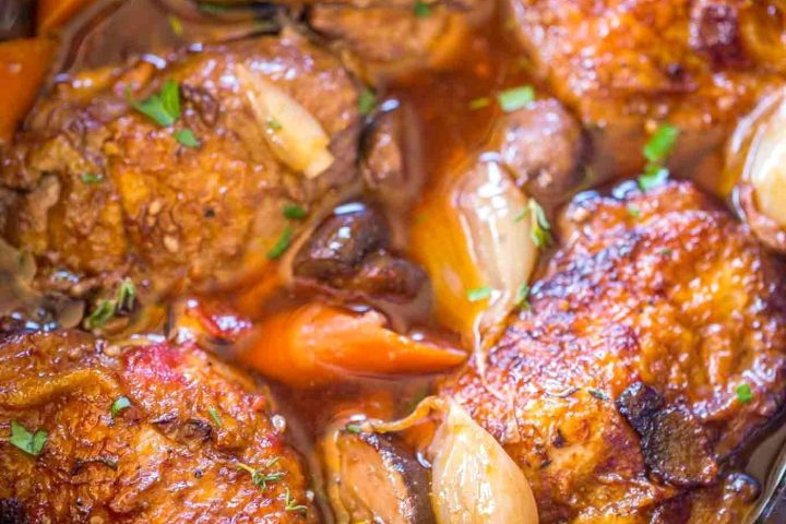 a dish is filled with meat and vegetables