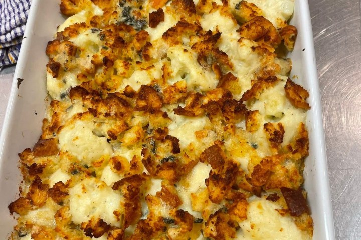 a plate of food with a slice of pizza