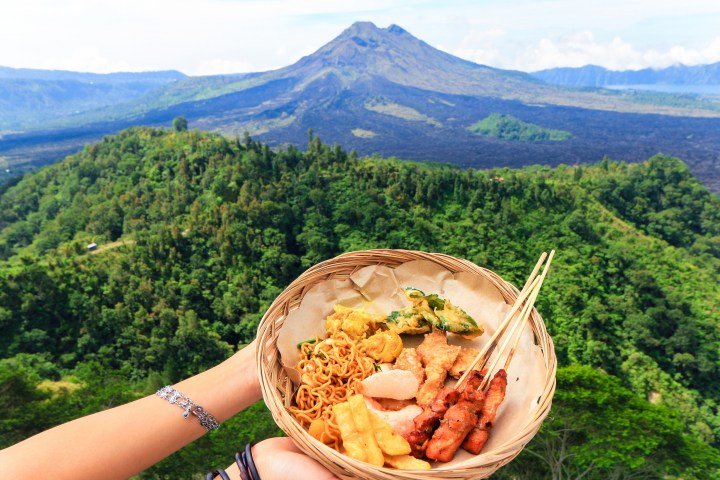 a plate with a mountain in the background