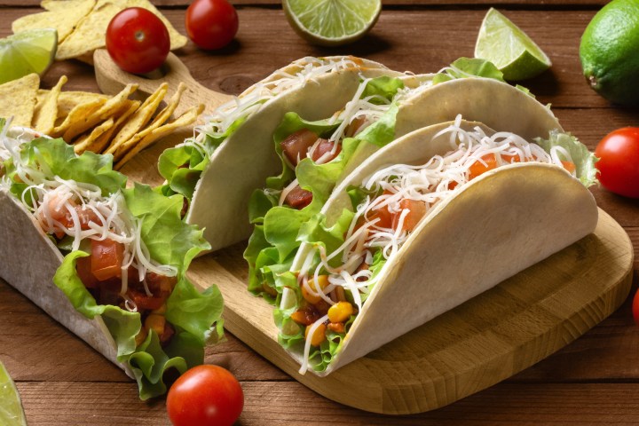 a sandwich sitting on top of a wooden table
