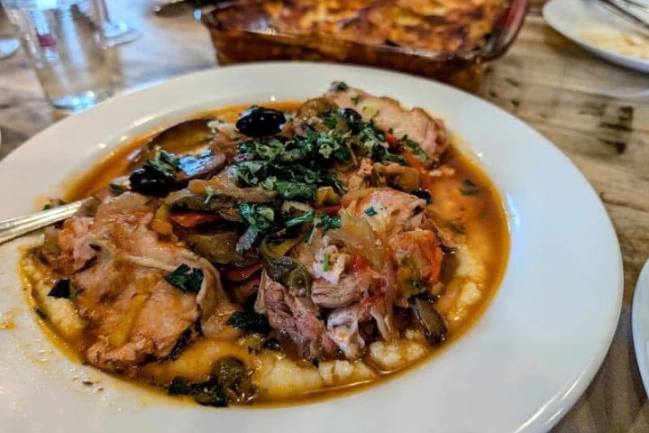 a pizza sitting on top of a plate of food