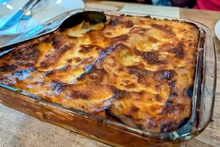 a pizza sitting on top of a cutting board