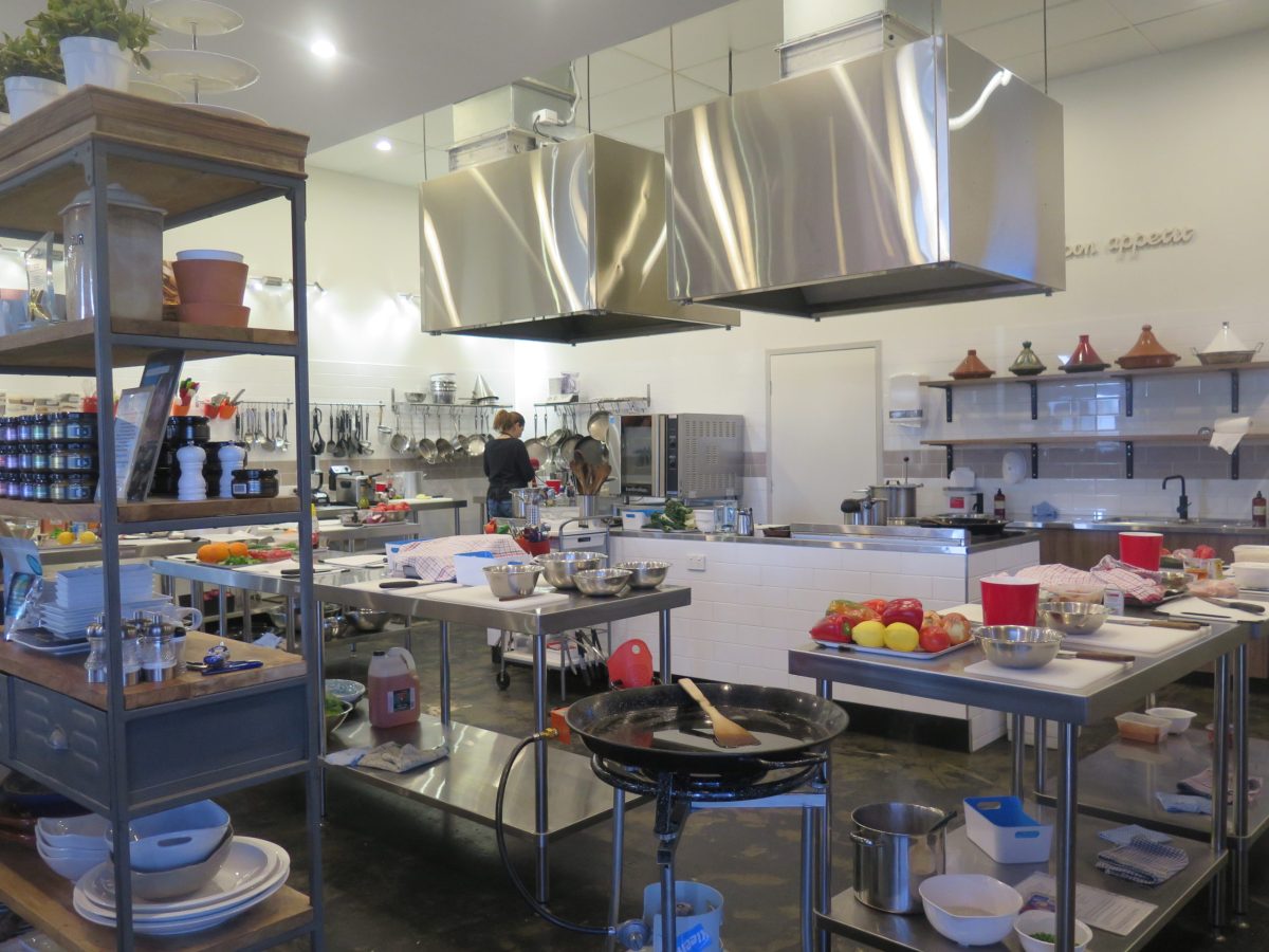 a person cooking food in a kitchen