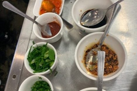 a bowl filled with different types of food on a table