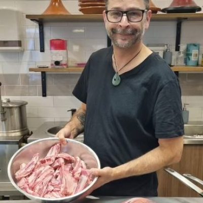 a person holding a tray of food