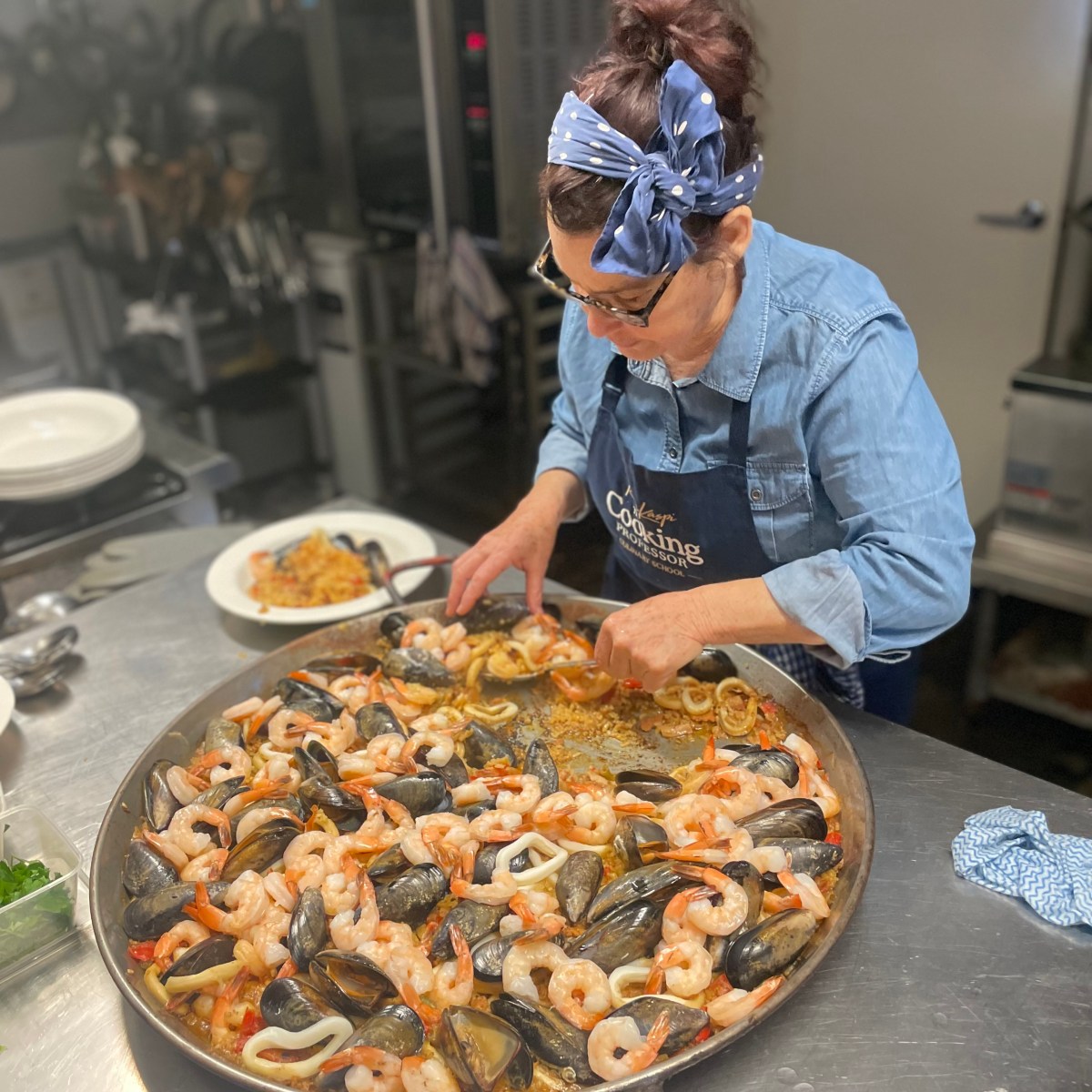 a person is cutting into a pizza